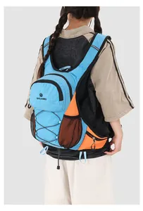 Lightweight blue and orange outdoor cycling hydration backpack shown on a female model