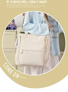 Detailed view of beige minimalist student backpack featuring multiple functional pockets