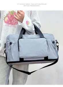 Large gray travel gym bag with multiple storage pockets for short trips and gym use