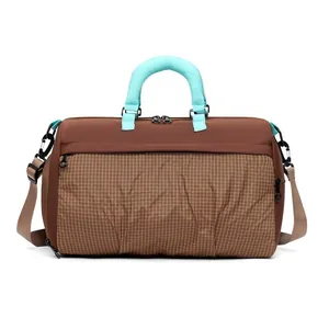 Large capacity brown checkered travel duffel bag with blue handles for sports fitness