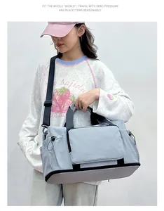 Young woman carrying a large light blue gym bag with dry wet separation compartment