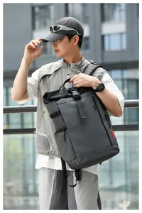 Waterproof oxford cloth men's laptop backpack shown in a modern urban lifestyle setting