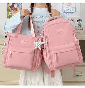 Pink waterproof student backpack and matching tote bag set in Japanese school style
