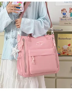 Side view of a pink minimalist waterproof backpack featuring multiple pockets and zippers