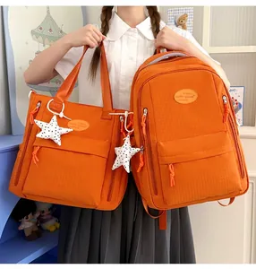 Vibrant orange Japanese style student backpack and tote bag set featuring star charms