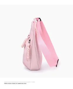 Detailed side view of a stylish pink Oxford fabric crossbody chest bag for women