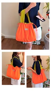 Large capacity orange drawstring tote bag shown in multiple lifestyle views for travel