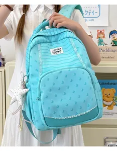 Cute light blue striped student backpack with star charm and butterfly pattern details