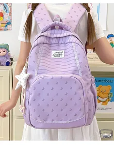 Purple butterfly print school backpack for students with lace details and a white star charm