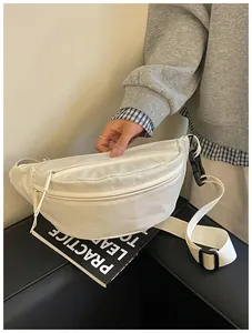 Detailed view of white minimalist nylon fanny pack with adjustable strap and black buckle.