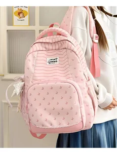 Detailed view of a cute pink striped student backpack with butterfly patterns and lace