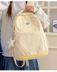 Cream striped student backpack with butterfly print and plush star charm accessory