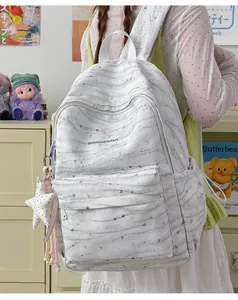 Detail of white tie-dye schoolbag with Wonderful embroidery and star charm