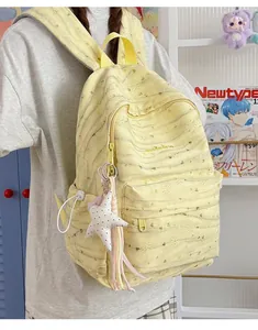 Yellow Korean style minimalist student backpack with large capacity and star charm detail