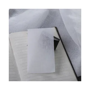 Premium white absorbent blotting paper for fountain pen ink on a minimalist notebook background