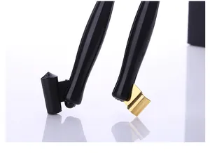 Close-up of resin oblique dip pen holders showing black and gold nib flange details.