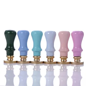 European vintage wax seal stamps set with colorful wooden handles and polished brass heads