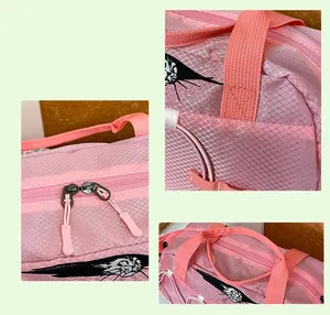 Macro view of pink grid texture fabric and heavy-duty zipper on travel duffel bag