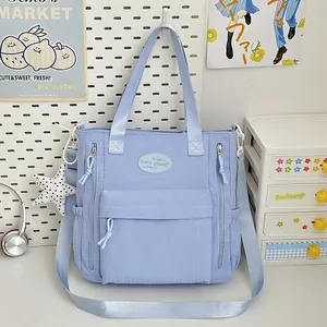 Light blue waterproof student schoolbag with large capacity and multi-pocket design