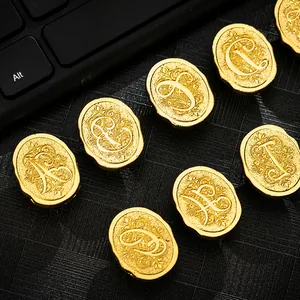 Vintage gold metal wax seal stamps with ornate floral alphabet letters A to G set