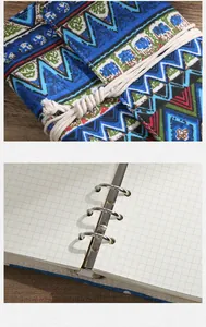 Detailed view of the bohemian fabric cover and metal ring binder of a retro notebook