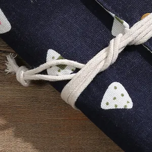 Vintage artistic fabric notebook featuring white patterns and a cream cotton rope closure