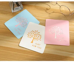 Creative laser-cut greeting cards with tree design and Just For You text details.