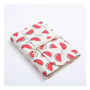 Vintage canvas cloth-covered notebook with red watermelon prints and string tie closure