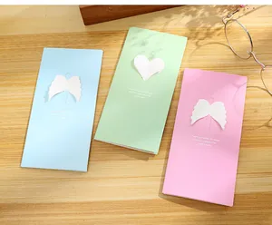 Set of three colorful creative hollow greeting cards with heart and wing designs