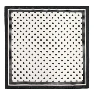 Detailed top view of 90cm square silk scarf with classic black polka dot pattern