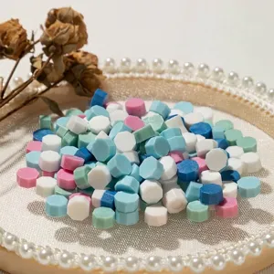 Mixed octagonal wax seal beads on vintage pearl tray for romantic DIY envelope sealing
