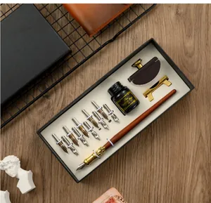 Professional vintage wooden calligraphy dip pen set with 10 nibs and ink in a gift box