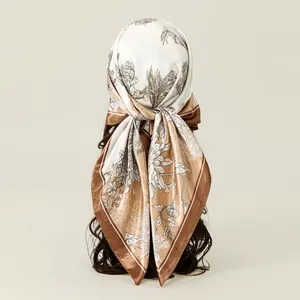 Elegant floral satin square scarf tied on long wavy hair, champagne and white design