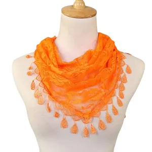 Orange lace triangular scarf for women, hollow floral fringe shawl and stylish neck wrap.