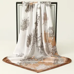 Elegant floral satin square scarf for women with soft silk-like texture and drape detail.