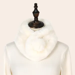Close-up of white faux rabbit fur neck warmer scarf on a professional mannequin