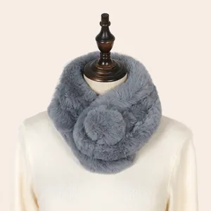 A detailed view of a plush gray faux fur scarf with a soft texture and warm design