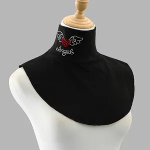 Detailed macro view of black Dralon fake collar with red heart and Angel rhinestone design.