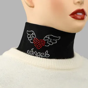 Close-up view of black high-neck fake collar with winged red heart rhinestone design