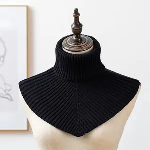 Close-up of black ribbed knit detachable turtleneck warmer on a mannequin torso