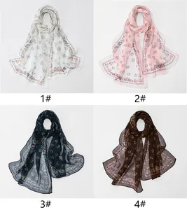 Overview of four elegant georgette long scarves with floral and paisley patterns