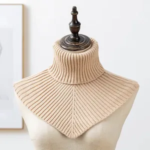 Detail view of beige ribbed knitted turtleneck neck warmer dickey for winter warmth