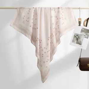 Close-up of lightweight floral print voile scarf showing delicate texture and pattern