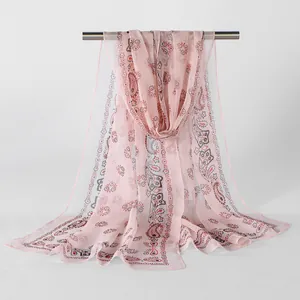 Detailed view of lightweight pink georgette scarf featuring vintage floral paisley print