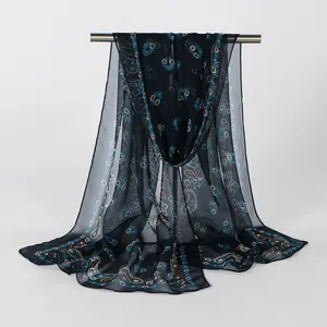 Detailed view of lightweight navy blue georgette scarf with elegant floral and paisley patterns