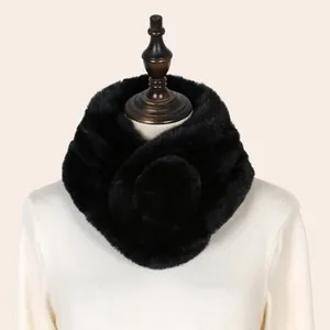 Macro detailed view of a luxurious soft black faux fur neck warmer shown on a mannequin