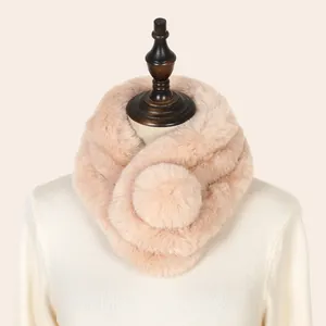 Detailed macro shot of the soft pink faux rabbit fur texture on a winter neck warmer