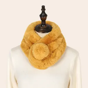 Close-up of yellow faux rabbit fur neck warmer on mannequin for winter warmth.