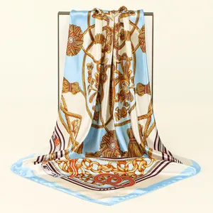 Elegant silk-like satin square scarf featuring a detailed nautical gold chain print design