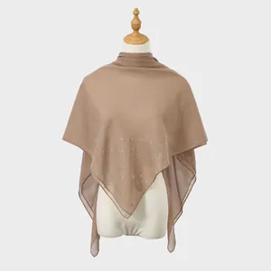 Close-up of sheer breathable mesh shawl with decorative rhinestone patterns for women.